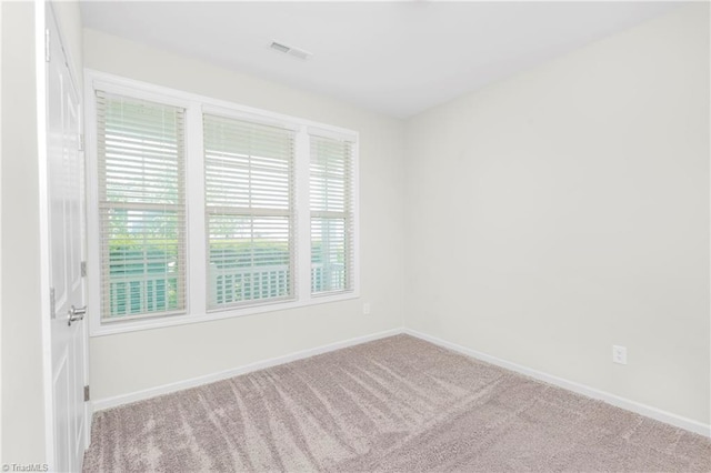 unfurnished room featuring carpet flooring