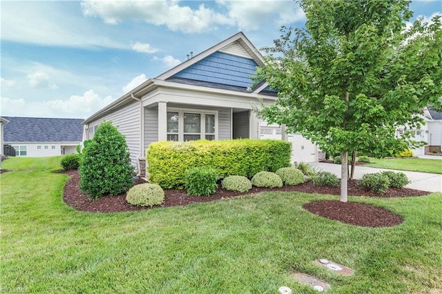 view of front of property with a garage and a front yard