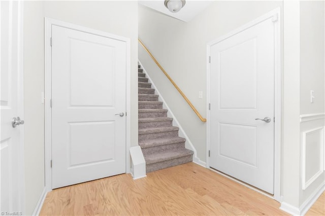 stairway featuring light hardwood / wood-style floors