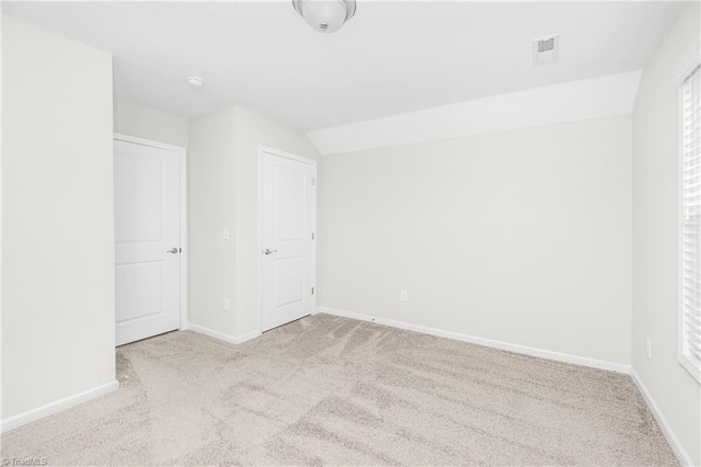 unfurnished bedroom featuring light colored carpet