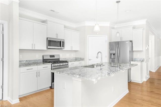 kitchen featuring white cabinetry, stainless steel appliances, light hardwood / wood-style flooring, and an island with sink