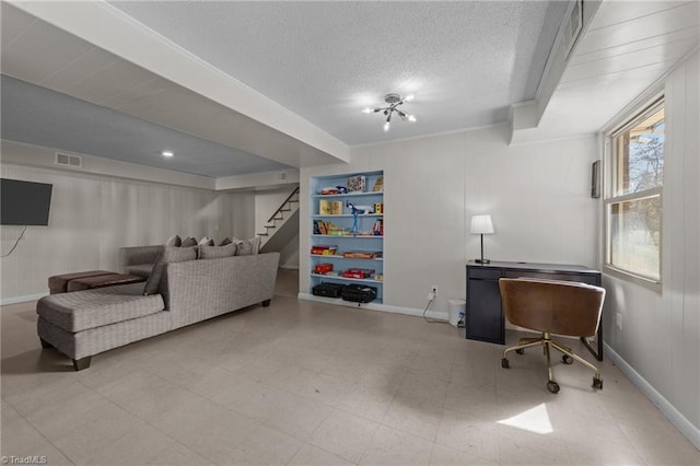 interior space with a textured ceiling, baseboards, visible vents, and tile patterned floors