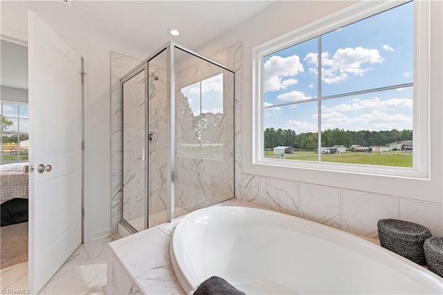 ensuite bathroom featuring a garden tub, ensuite bath, marble finish floor, a marble finish shower, and recessed lighting