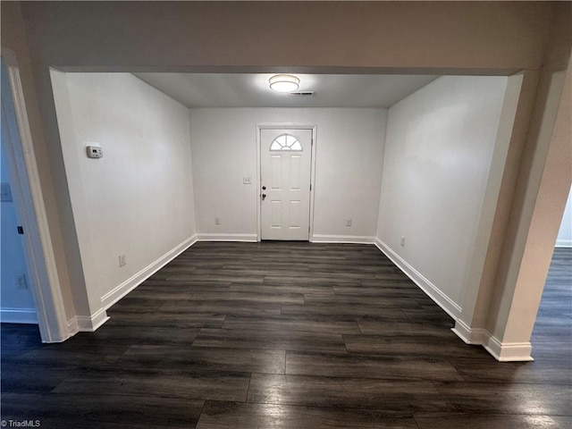 foyer entrance with dark hardwood / wood-style flooring