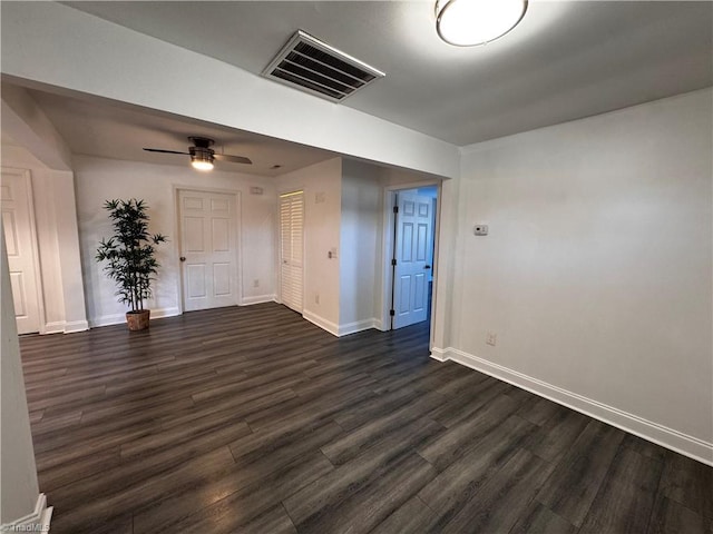 unfurnished room featuring dark hardwood / wood-style flooring and ceiling fan