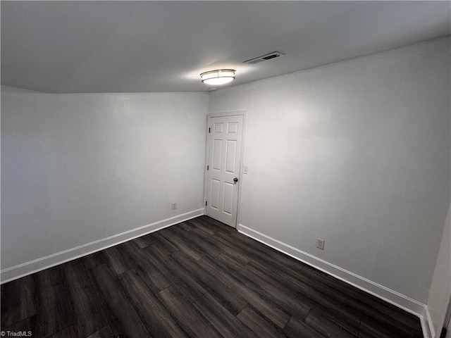 unfurnished room featuring dark hardwood / wood-style floors