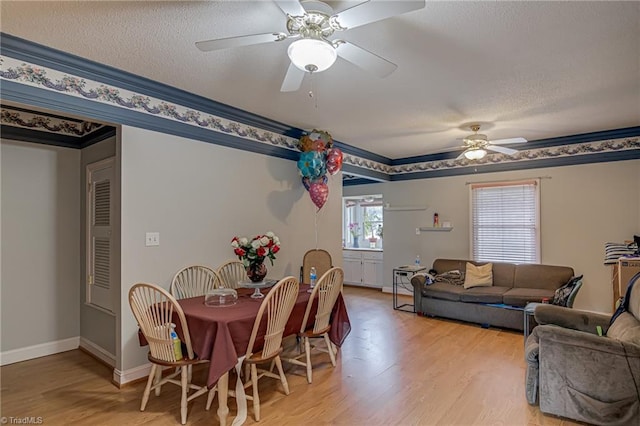 1401 Bretton St, Winston-Salem, NC 27105 - dining space with a ceiling fan, light wood finished floors, baseboards, and a textured ceiling