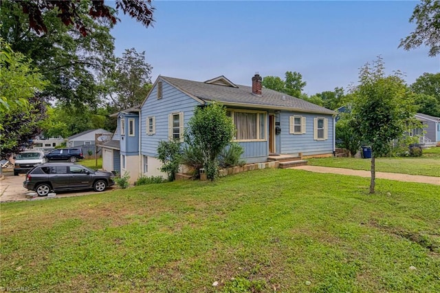 1401 Bretton St, Winston-Salem, NC 27105 - view of front facade with a chimney and a front lawn