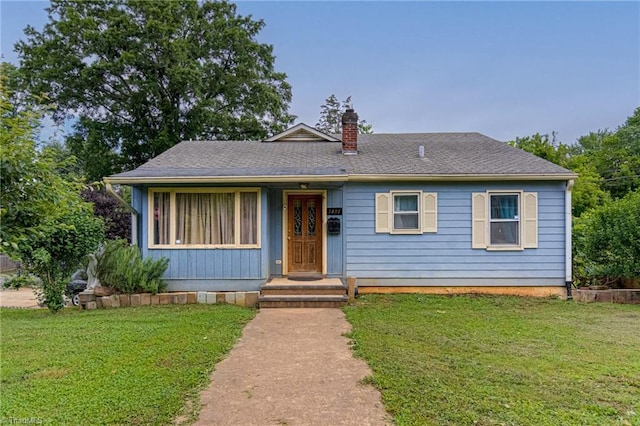 1401 Bretton St, Winston-Salem, NC 27105 - view of front of house with a chimney and a front lawn