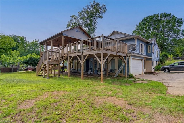 1401 Bretton St, Winston-Salem, NC 27105 - back of house featuring stairway, a garage, a yard, a wooden deck, and driveway