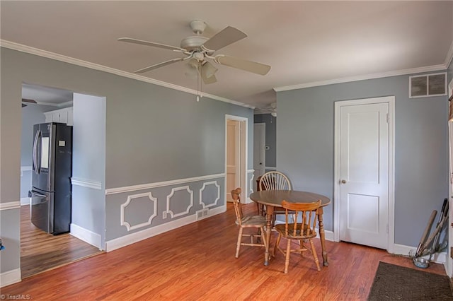 1401 Bretton St, Winston-Salem, NC 27105 - dining area with a ceiling fan, light wood-type flooring, ornamental molding, and baseboards