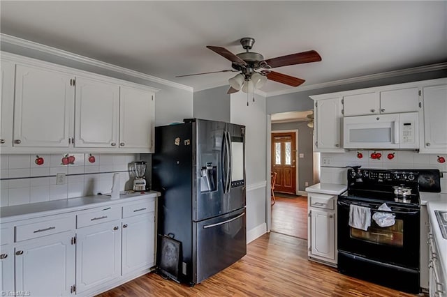 1401 Bretton St, Winston-Salem, NC 27105 - kitchen featuring electric range, white microwave, refrigerator with ice dispenser, ceiling fan, and light countertops