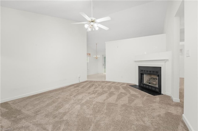 125 Haven Grove Trl, Clemmons, NC 27012 - unfurnished living room with carpet flooring, a fireplace with flush hearth, a chandelier, ceiling fan, and high vaulted ceiling