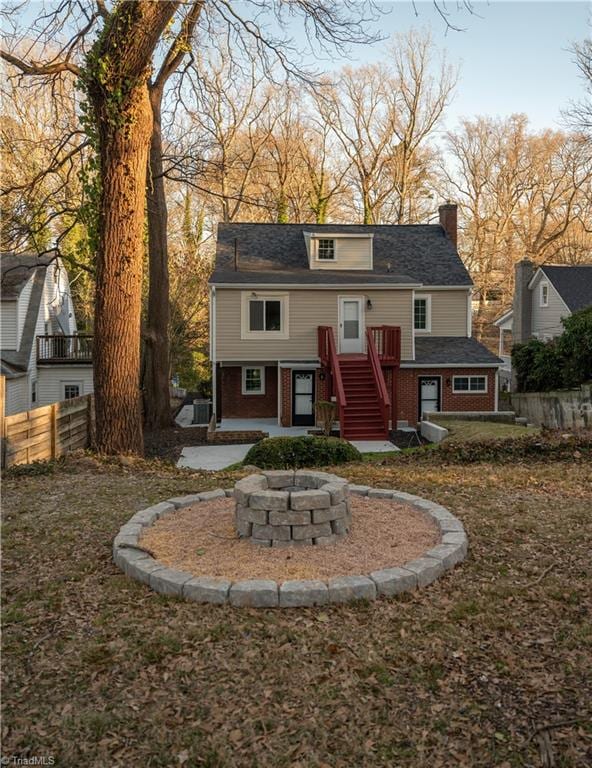 view of front facade with an outdoor fire pit