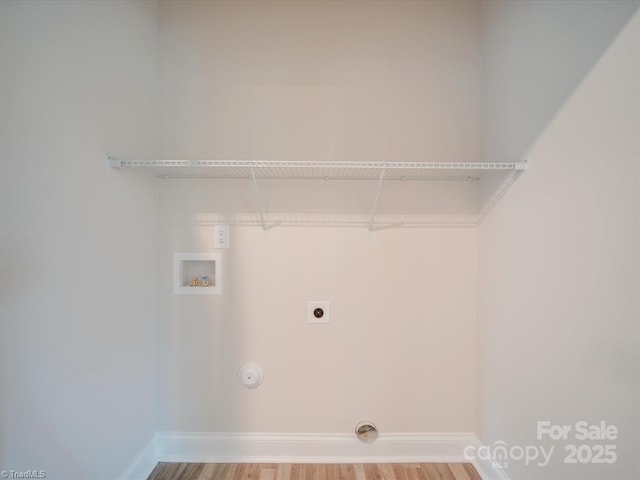 laundry area with electric dryer hookup, gas dryer hookup, hookup for a washing machine, and hardwood / wood-style floors