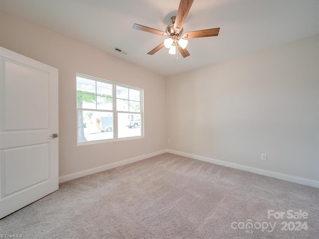 carpeted empty room with ceiling fan