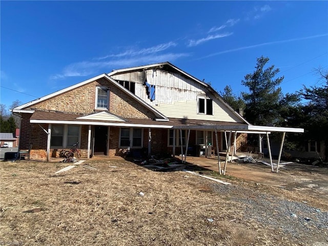 1020 Klondike Rd, State Road, NC 28676 - rear view of house featuring brick siding and a porch