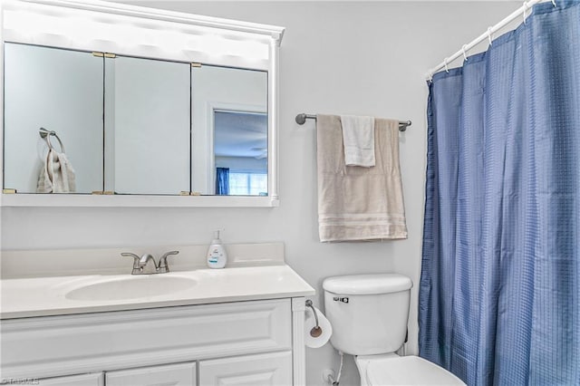 bathroom with vanity, toilet, and a shower with curtain