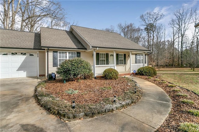 view of front facade with a garage, concrete driveway, a porch, and roof with shingles