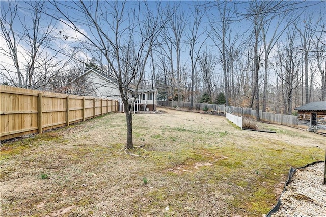 view of yard with a fenced backyard