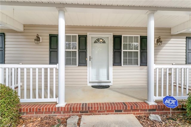 doorway to property featuring covered porch