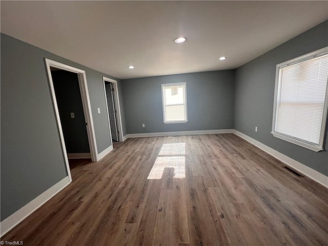 empty room featuring wood-type flooring