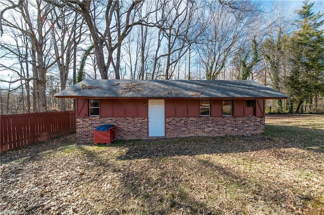 view of outbuilding featuring a lawn