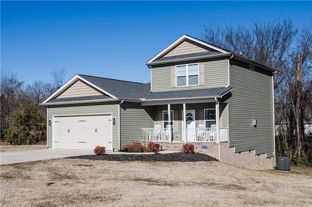 view of front facade with cooling unit, a garage, and a porch