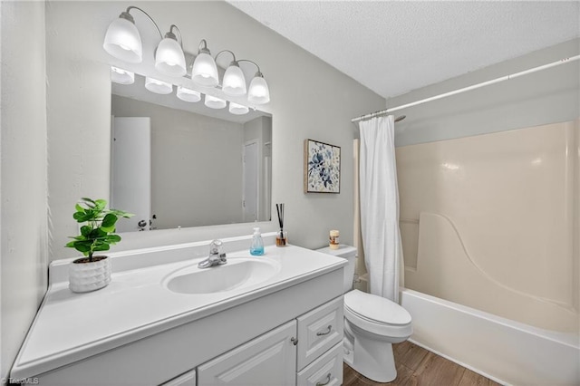 209 Brewer Cir, East Bend, NC 27018 - bathroom featuring vanity, wood finished floors, shower / bath combination with curtain, and a textured ceiling