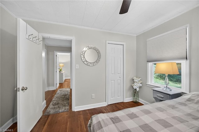 209 Brewer Cir, East Bend, NC 27018 - bedroom featuring wood finished floors, a closet, ornamental molding, and a ceiling fan