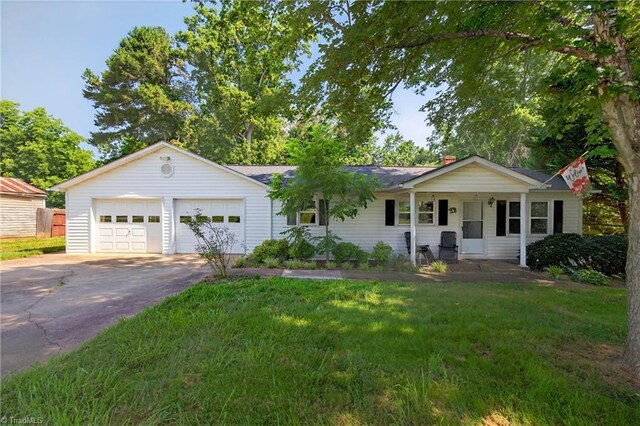 209 Brewer Cir, East Bend, NC 27018 - single story home with driveway and a garage