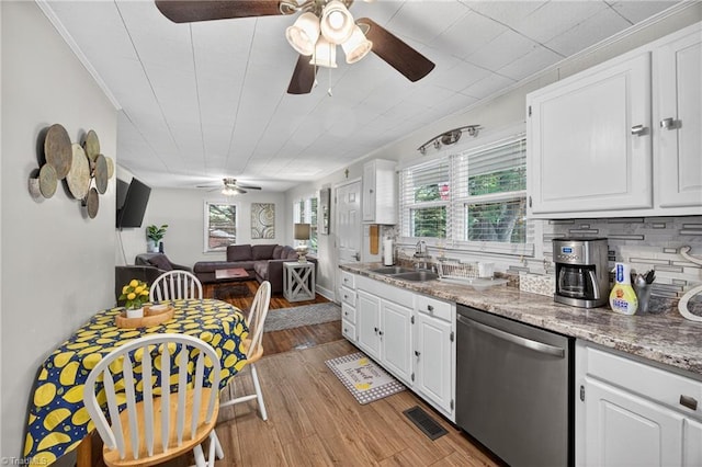 209 Brewer Cir, East Bend, NC 27018 - kitchen featuring stainless steel dishwasher, a ceiling fan, crown molding, white cabinets, and light wood-style flooring