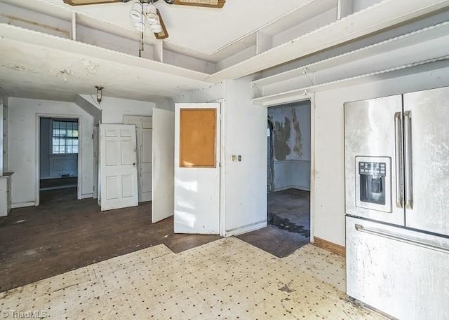 kitchen featuring stainless steel fridge with ice dispenser, dark hardwood / wood-style floors, and ceiling fan