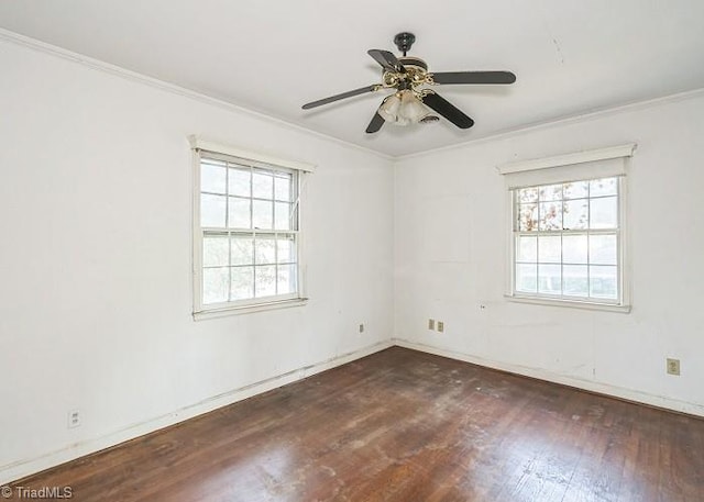 empty room featuring ceiling fan, dark hardwood / wood-style flooring, and crown molding