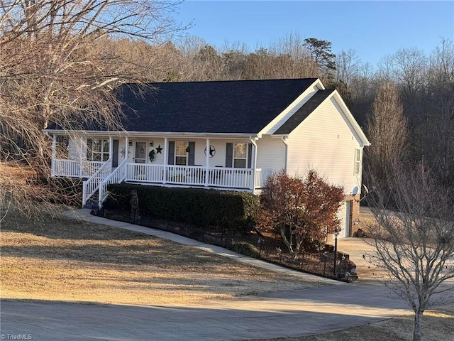 view of front of home featuring a garage and covered porch