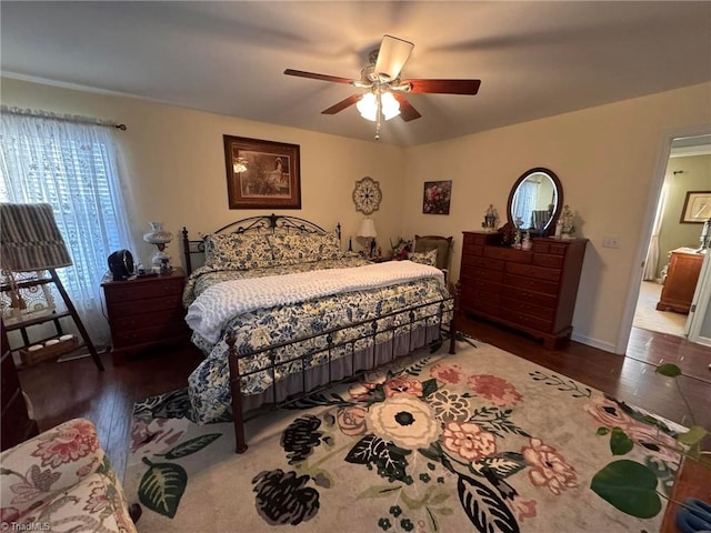 bedroom featuring ceiling fan and dark hardwood / wood-style floors