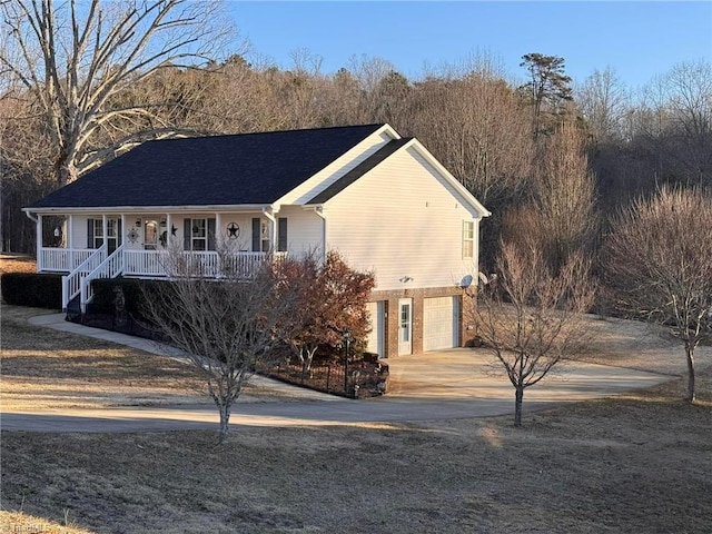 view of front of property with a garage and a porch