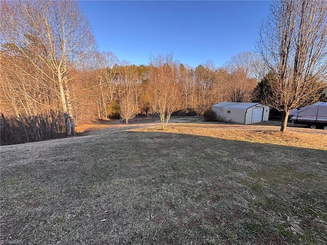 view of yard with an outbuilding and a garage