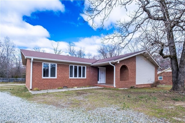 single story home with crawl space and brick siding