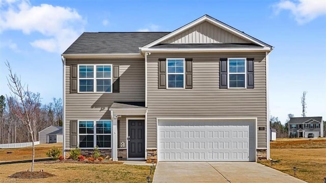 craftsman inspired home featuring a garage, driveway, a front lawn, and stone siding