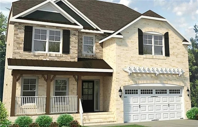 view of front of property with a garage and covered porch