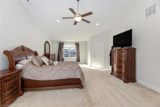 carpeted bedroom with ceiling fan and high vaulted ceiling