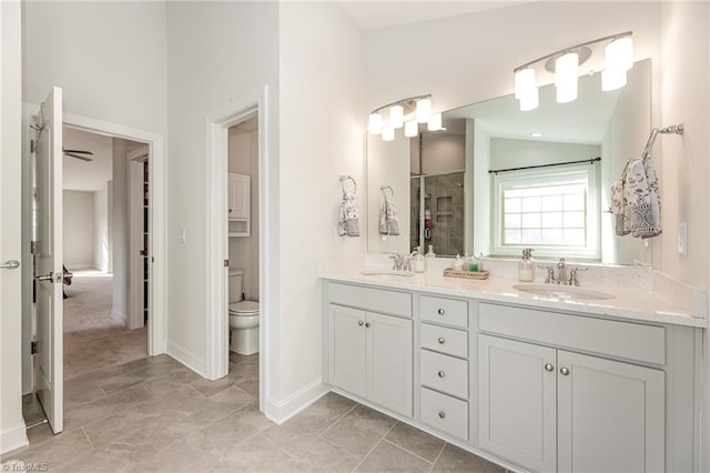 bathroom with toilet, vaulted ceiling, tile patterned flooring, vanity, and walk in shower