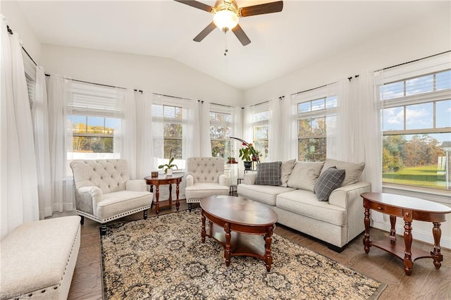 sunroom / solarium featuring a wealth of natural light, ceiling fan, and lofted ceiling