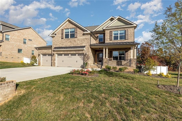 craftsman house featuring a garage, covered porch, and a front yard