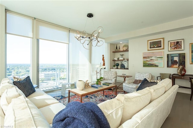 living room featuring a notable chandelier, a wall of windows, and wood-type flooring