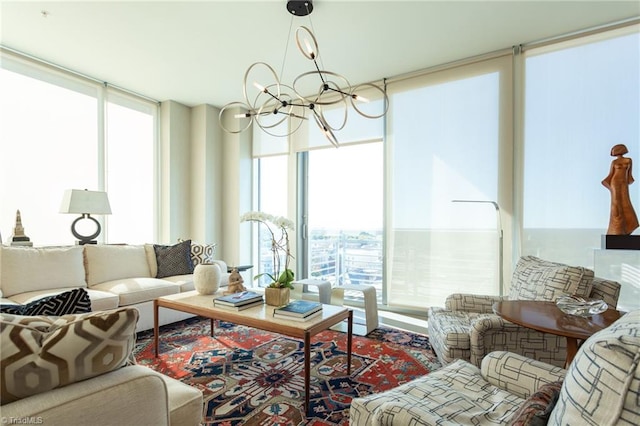 sunroom / solarium featuring a notable chandelier