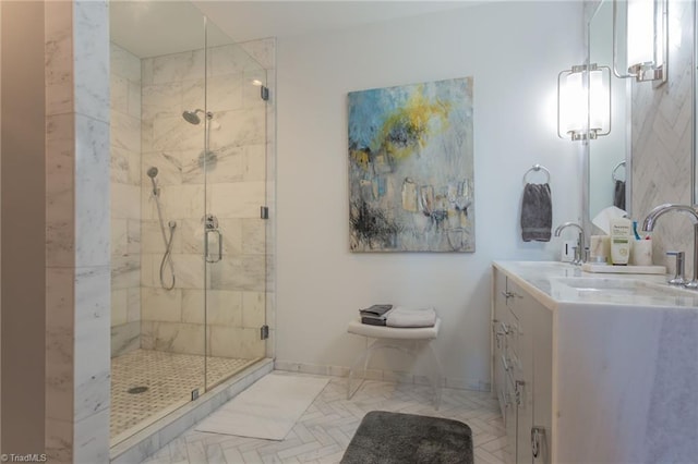 bathroom with a shower with door and vanity