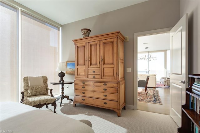 bedroom featuring a notable chandelier