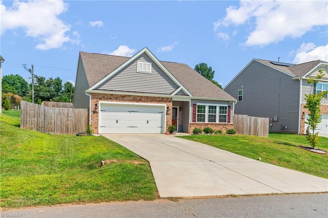 view of front facade with driveway, a front yard, fence, and brick siding